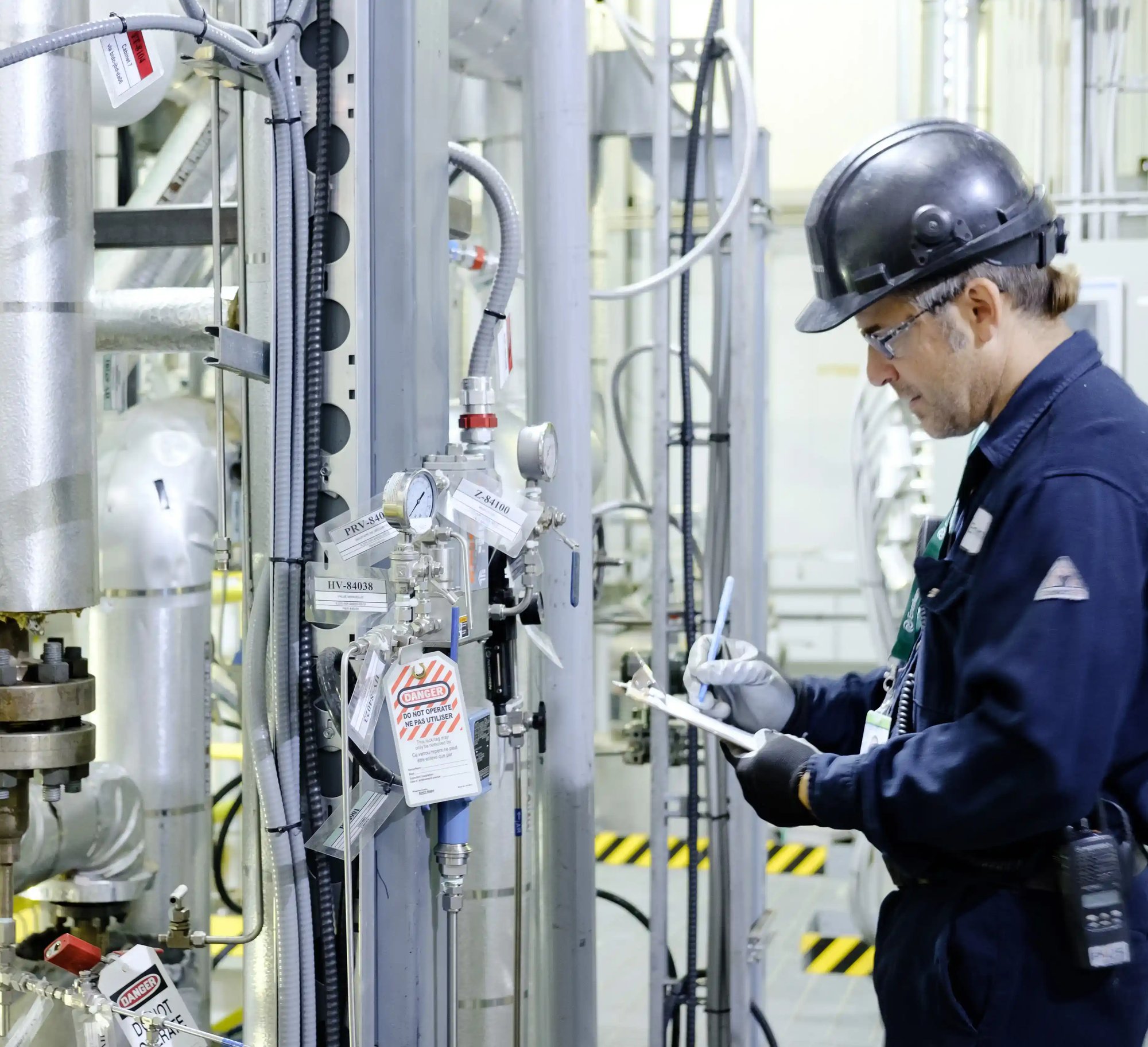 a person in a helmet working on a machine