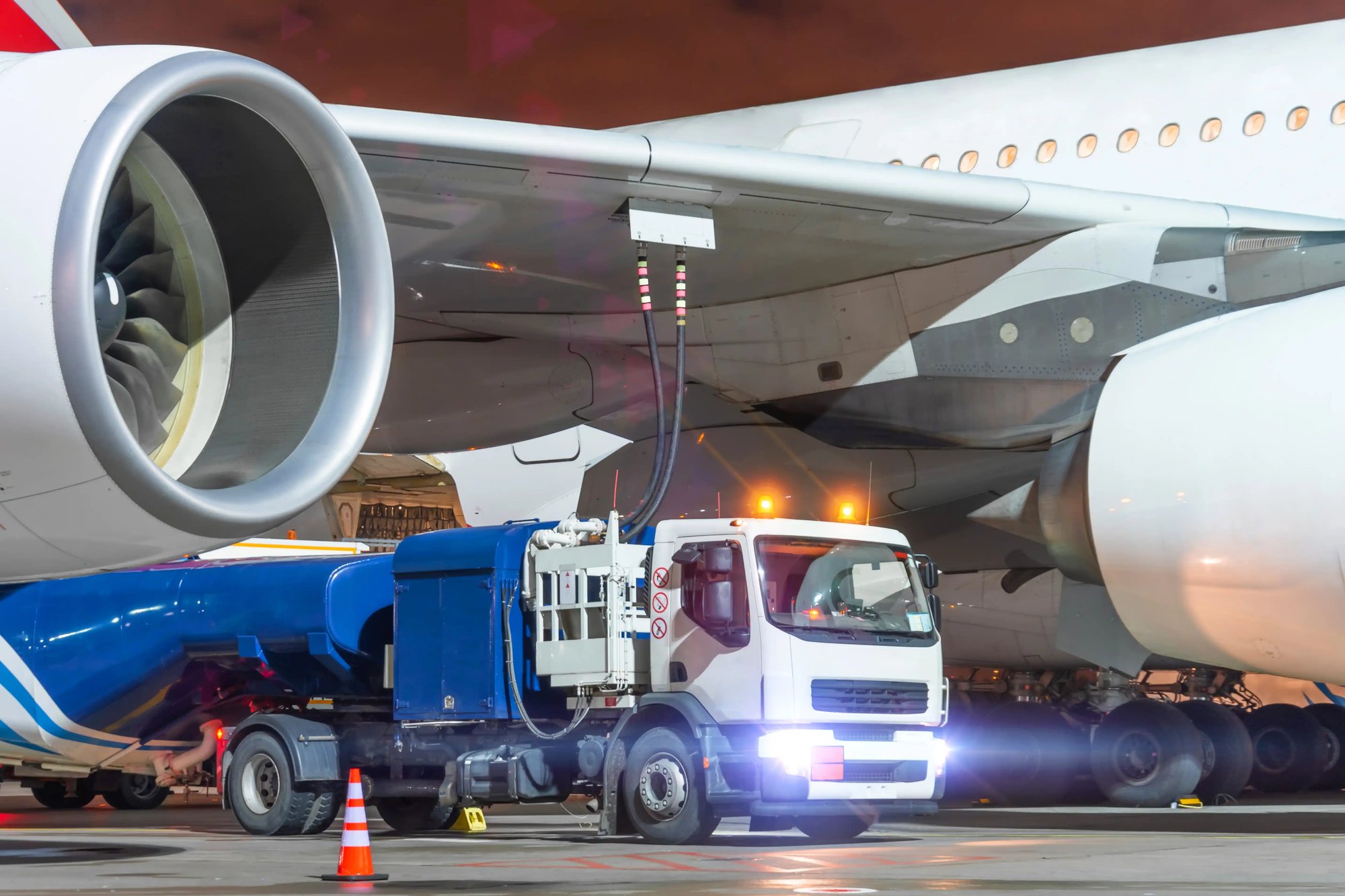 a truck next to an airplane